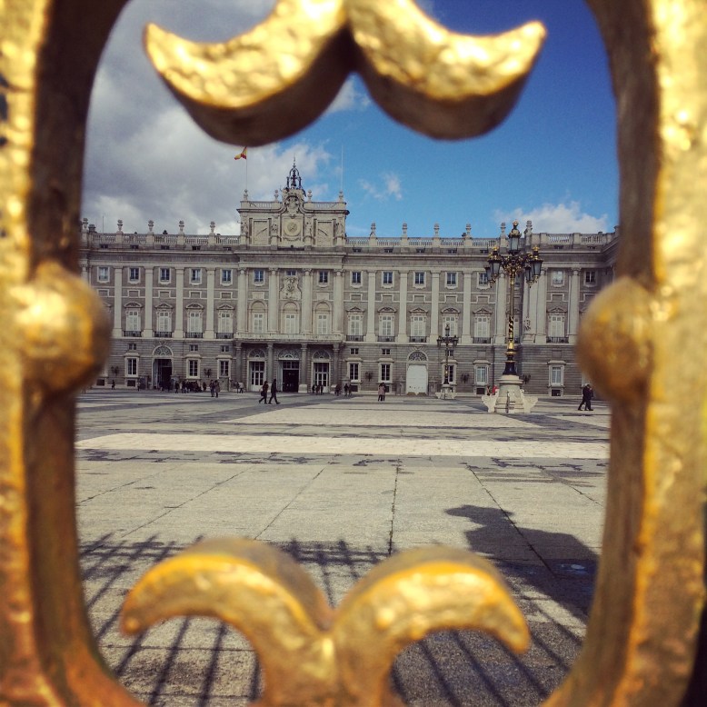 Royal Palace in Madrid framed by the gated entrance 